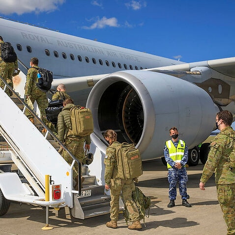 A contingent of Air Force and Army personnel board a waiting KC-30A Multi-Role Tanker Transport aircraft at RAAF Base Amberley bound for the Middle East