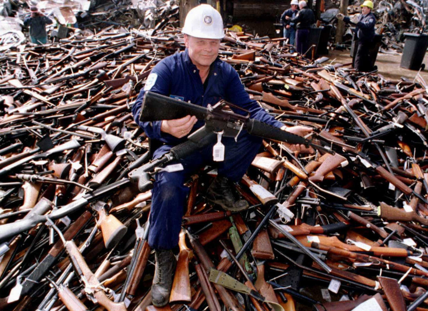 A security official holds an armalite rifle similar to the one used in the Port Arthur massacre, handed in for scrap in the gun amnesty 