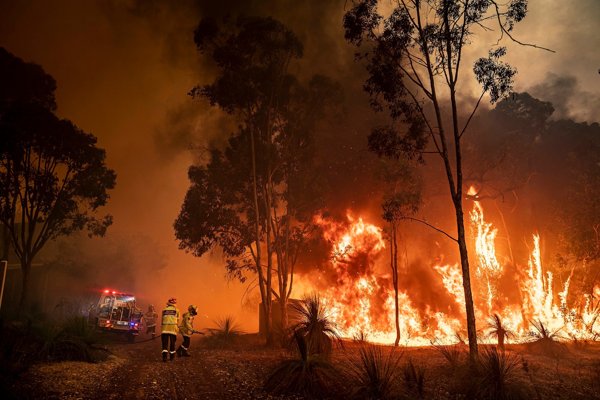 A supplied image obtained on Monday, December 27, 2021, of Fire fighters in Western Australia battling a blaze at Chidlow and Wooroloo Bushfire, WA (AAP Image/Supplied by DFES, Evan Collis) NO ARCHIVING, EDITORIAL USE ONLY