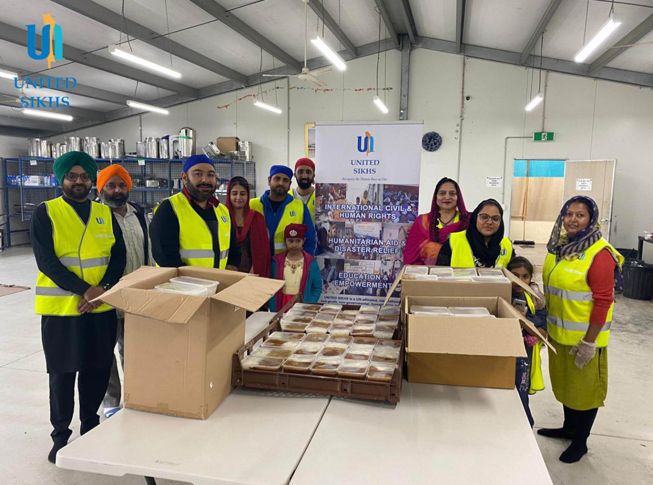 United Sikhs volunteers packing food containers at Tarneit. 