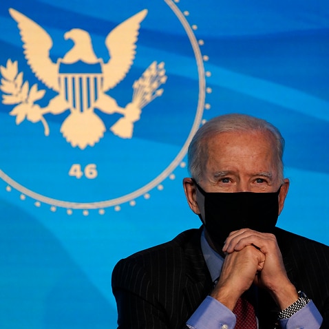 Joe Biden listens during an event at The Queen theater in Wilmington, Del., Friday, Jan. 8, 2021, to announce key administration posts. (AP Photo/Susan Walsh)