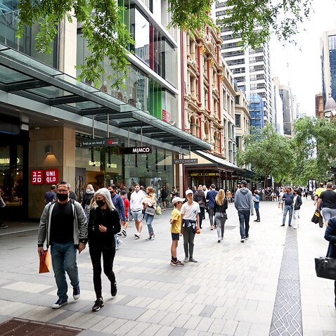 Shoppers walk around Pitt Street Mall in Sydney, Saturday, October 16, 2021. After 106 days, almost 63,000 cases and nearly 440 deaths, stay-at-home orders were lifted and a raft of restrictions eased across NSW on Monday.