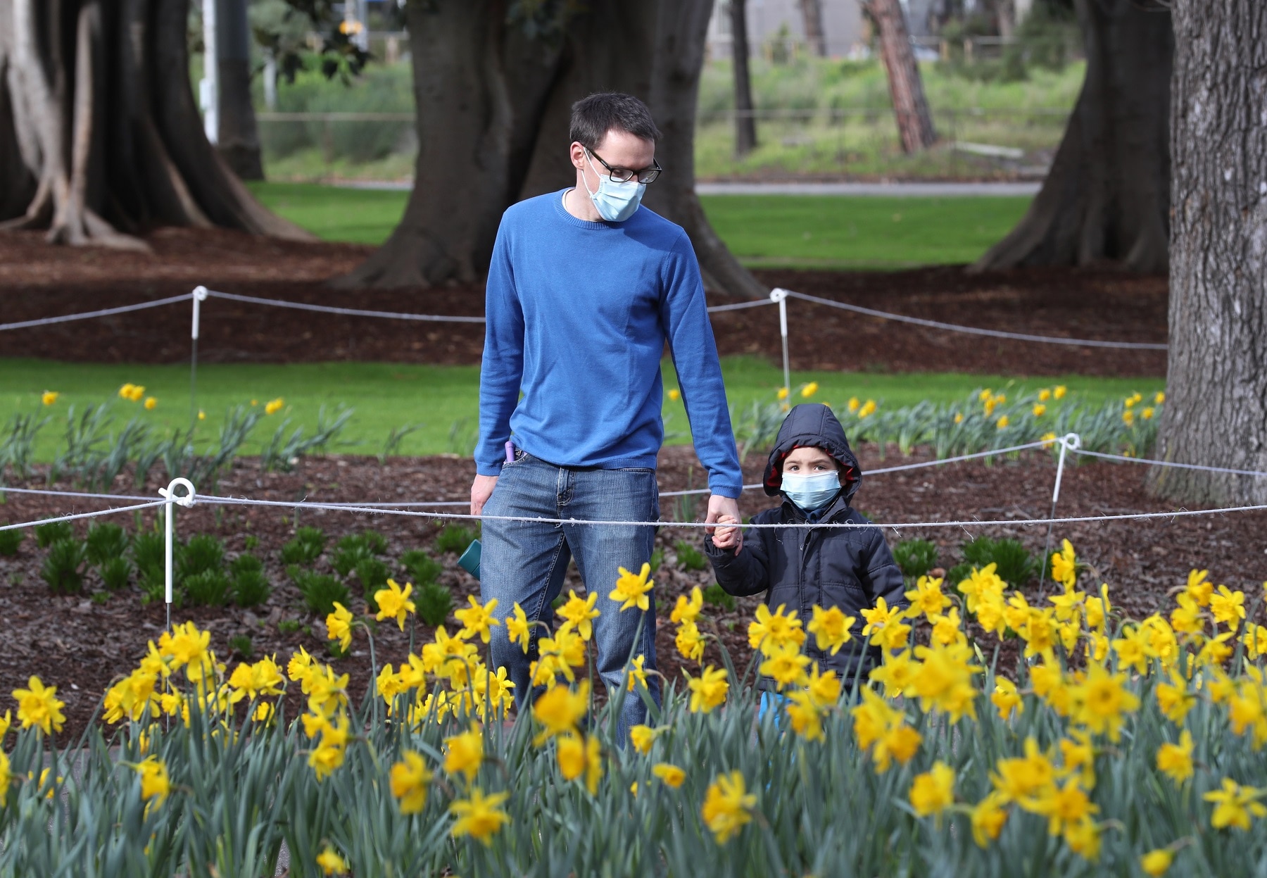 People are seen at Fitzroy Gardens in East Melbourne,