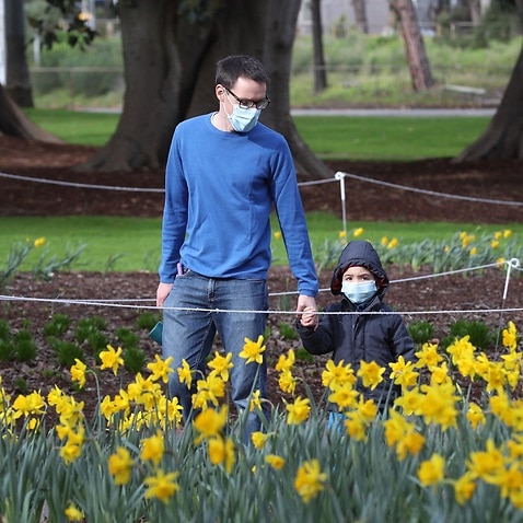 People are seen at Fitzroy Gardens in East Melbourne,