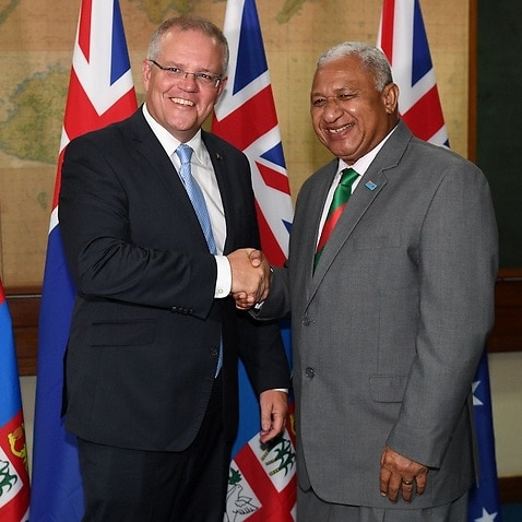 Australian Prime Minister Scott Morrison shakes hands with Prime Minister of Fiji Frank Bainimarama.