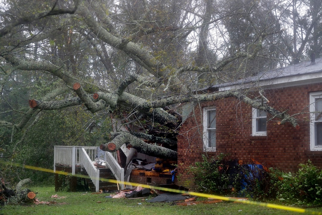 A fallen tree crashed through the home where a woman and her baby were killed in Wilmington North Carolina after Hurricane Florence made landfall.