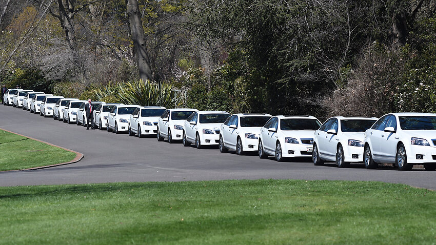 Comcars line the road outside Government House in Canberra.