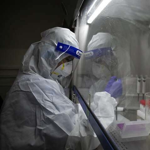 A laboratory technologist processes COVID-19 samples at the Bidh Lab in Nepal where oversea coronavirus variants have been recorded. 