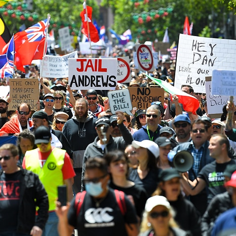 People participate in a 'The Worldwide Rally for Freedom' protest against mandatory vaccinations and lockdown measures in Melbourne.