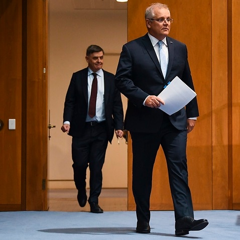 Australian Prime Minister Scott Morrison arrives to speak to the media during a press conference at Parliament House in Canberra, Friday, June 12, 2020. (AAP Image/Lukas Coch) NO ARCHIVING