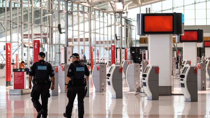 Police Officers patrolling in the Departures Hall of Sydney Domestic Airport.