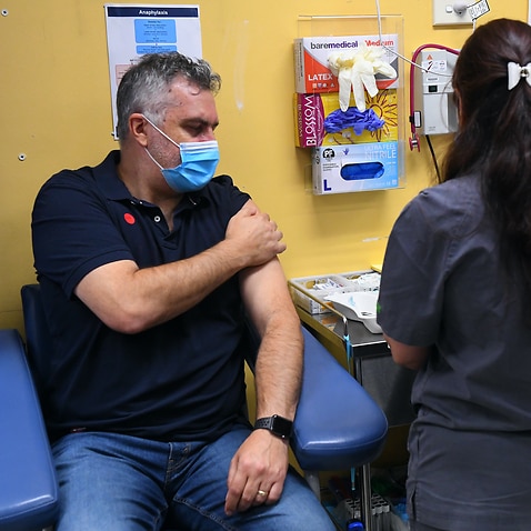 Victoria Aboriginal Health Services chief executive Michael Graham receives a COVID-19 vaccination in Melbourne on Monday.