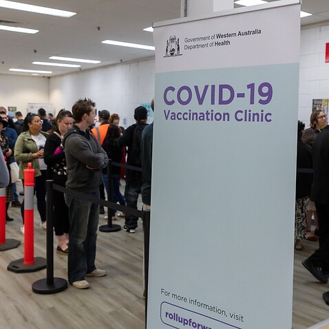 Members of the public wait to be vaccinated at a COVID-19 mass vaccination clinic in Midland, an eastern suburb of Perth.