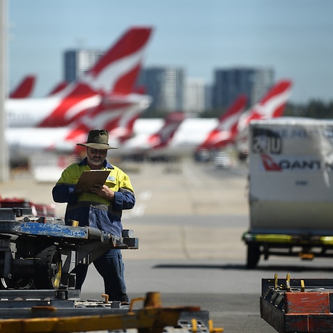 Qantas aircraft a Sydney Airport in Sydney, Thursday, March 19, 2020. Qantas has announced mandatory vaccination for its staff