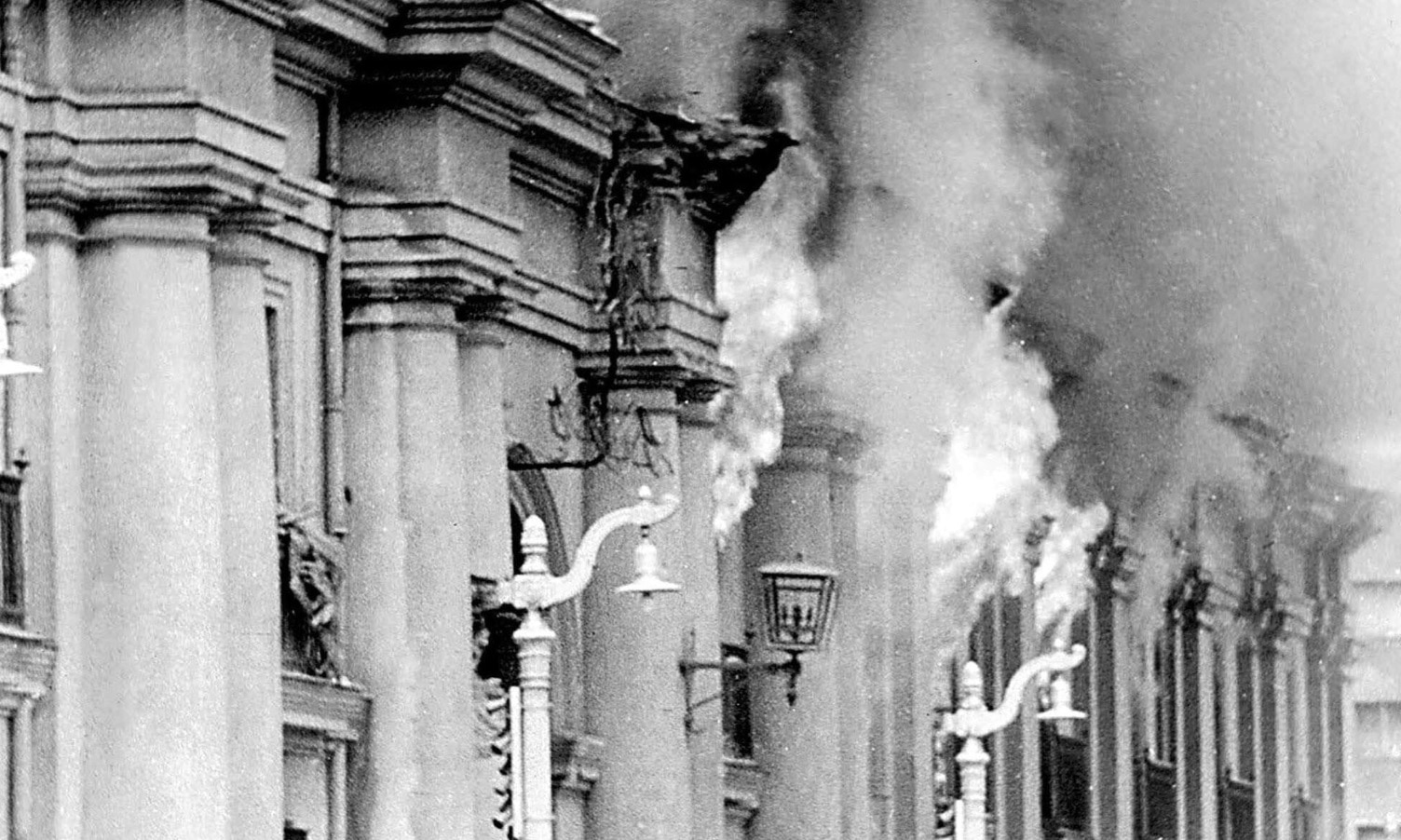 Smoke pours from the Chilean presidential palace, La Moneda, in this Sept. 11, 1973, file photo, after being hit by rockets fired by the air force Hawker Hunter jet fighters