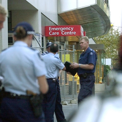 Melbourne, May 7, 2002. Police begin investigations at St.Vincents Hospital where a man was shot dead this afternoon. The man, a prisoner under-going medical treatment was shot whilst trying to escape. (AAP Image/Julian Smith) NO ARCHIVING
