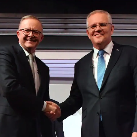 Prime Minister Scott Morrison (right) and Opposition Leader Anthony Albanese shake hands at the start of the final leaders' debate.