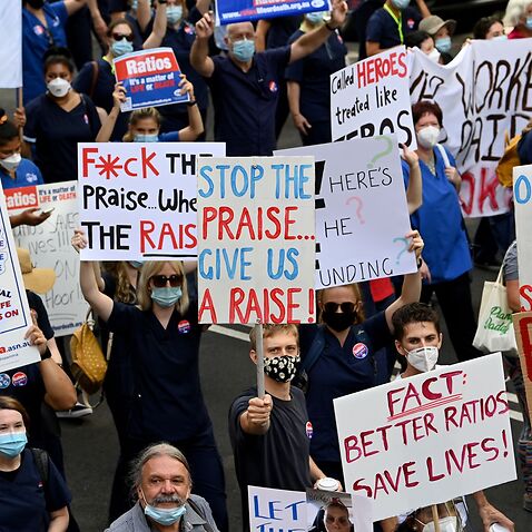 NSW nurses hold placards during a nurses’ strike in Sydney 