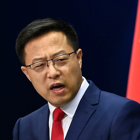 Chinese Foreign Ministry spokesman Zhao Lijian attends a press conference in Beijing.