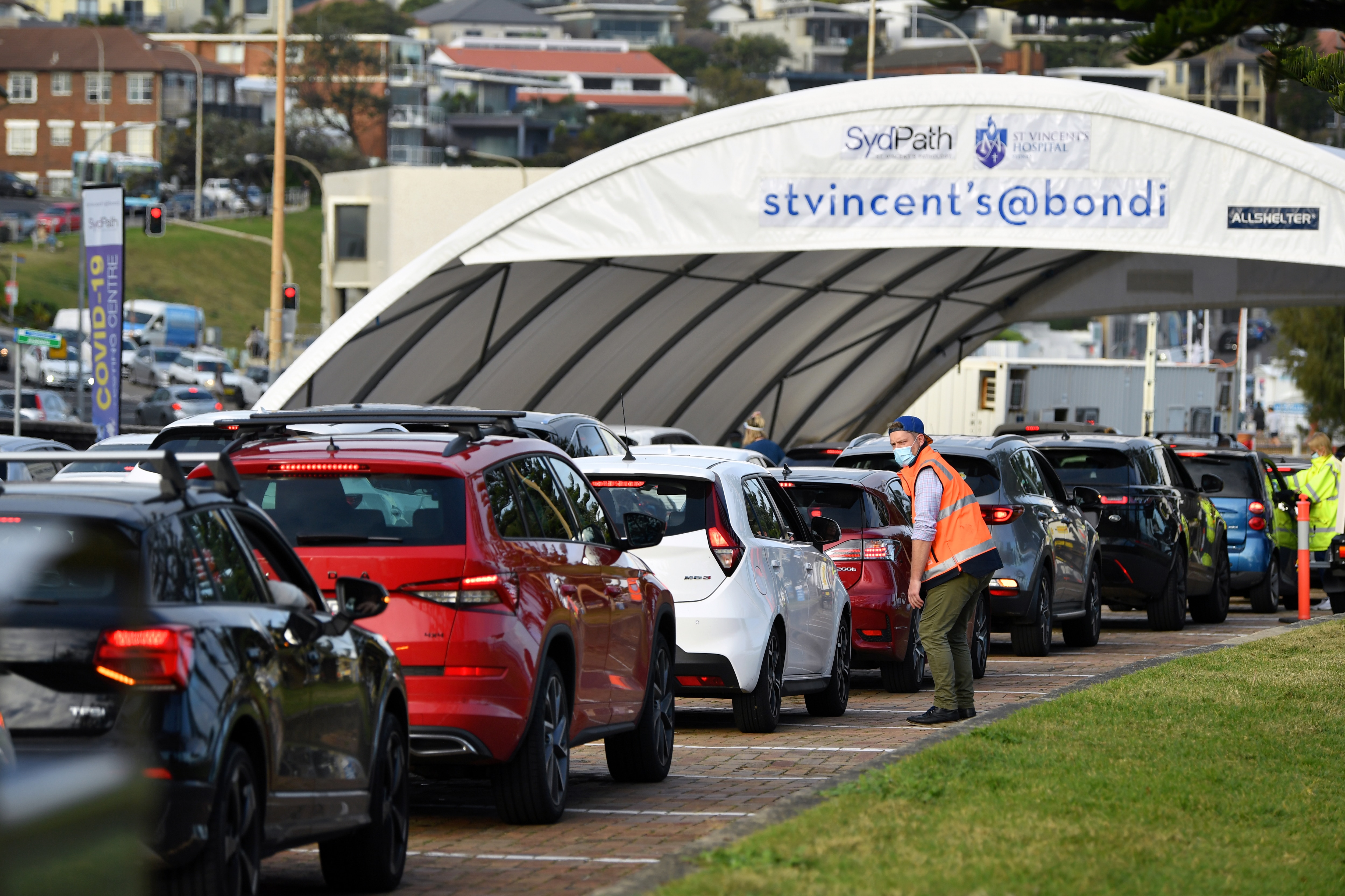 Cars line up for COVID-19 testing at Bondi in Sydney on Tuesday.