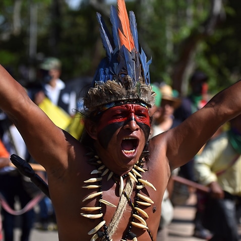 A indigenous Colombian man shouts slogans during the march for the Pan America way in Columbia.