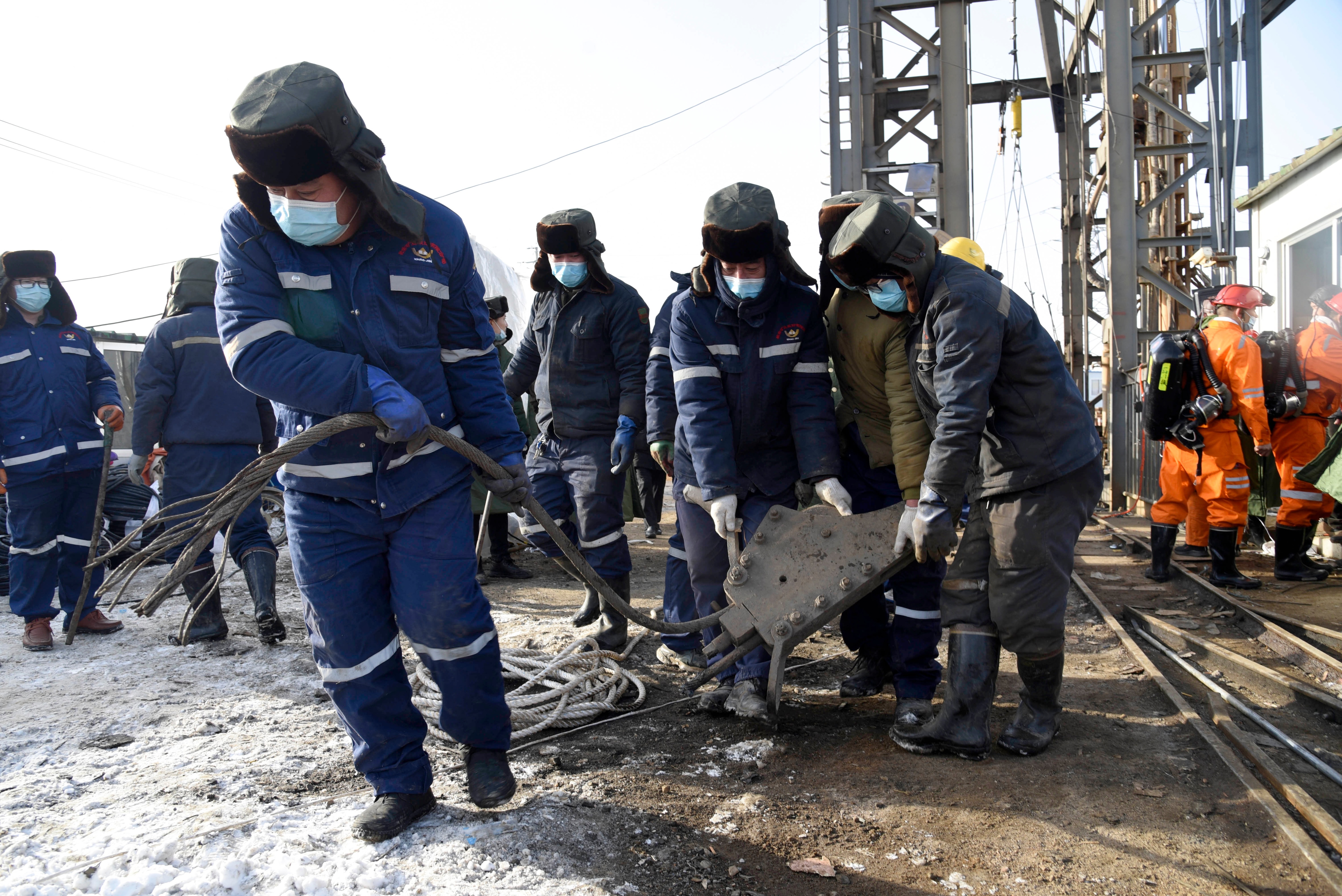 In this photo released by Xinhua News Agency, rescuers work at the site of a gold mine that suffered an explosion in Shandong Province on 12 January. 