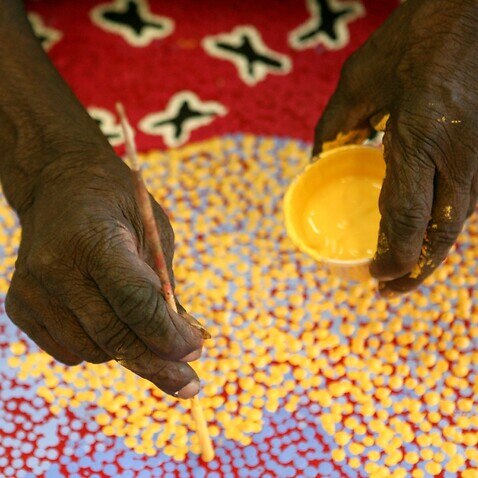 Aboriginal artist Paddy Stewart works on a dot painting at the Ngurratjuta Iltja Ntjarra Many Hands Art Center in Alice Springs in the Northern Territory, Jun 23, 2008. The Ngurratjuta Art Centre was established in 2003 to provide a place for Western Arra