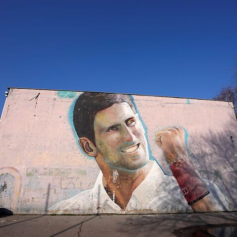 A mural depicting Serbian tennis player Novak Djokovic on a wall in Belgrade, Serbia, Sunday, Jan. 16, 2022. 