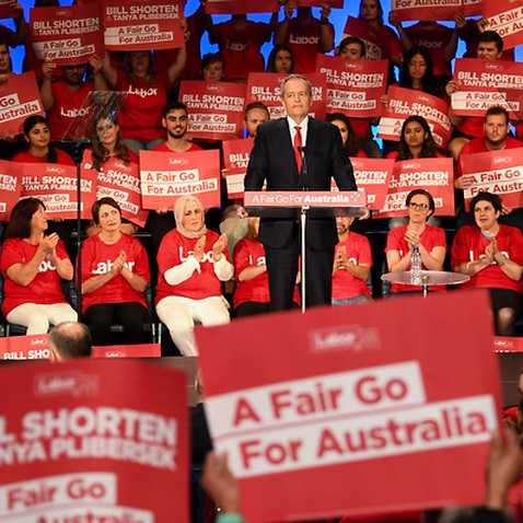 Labor party volunteers listen to Australian Opposition Leader Bill Shorten speak during a Labor volunteers rally at the Southern Cross Vocational College in Burwood in Sydney.