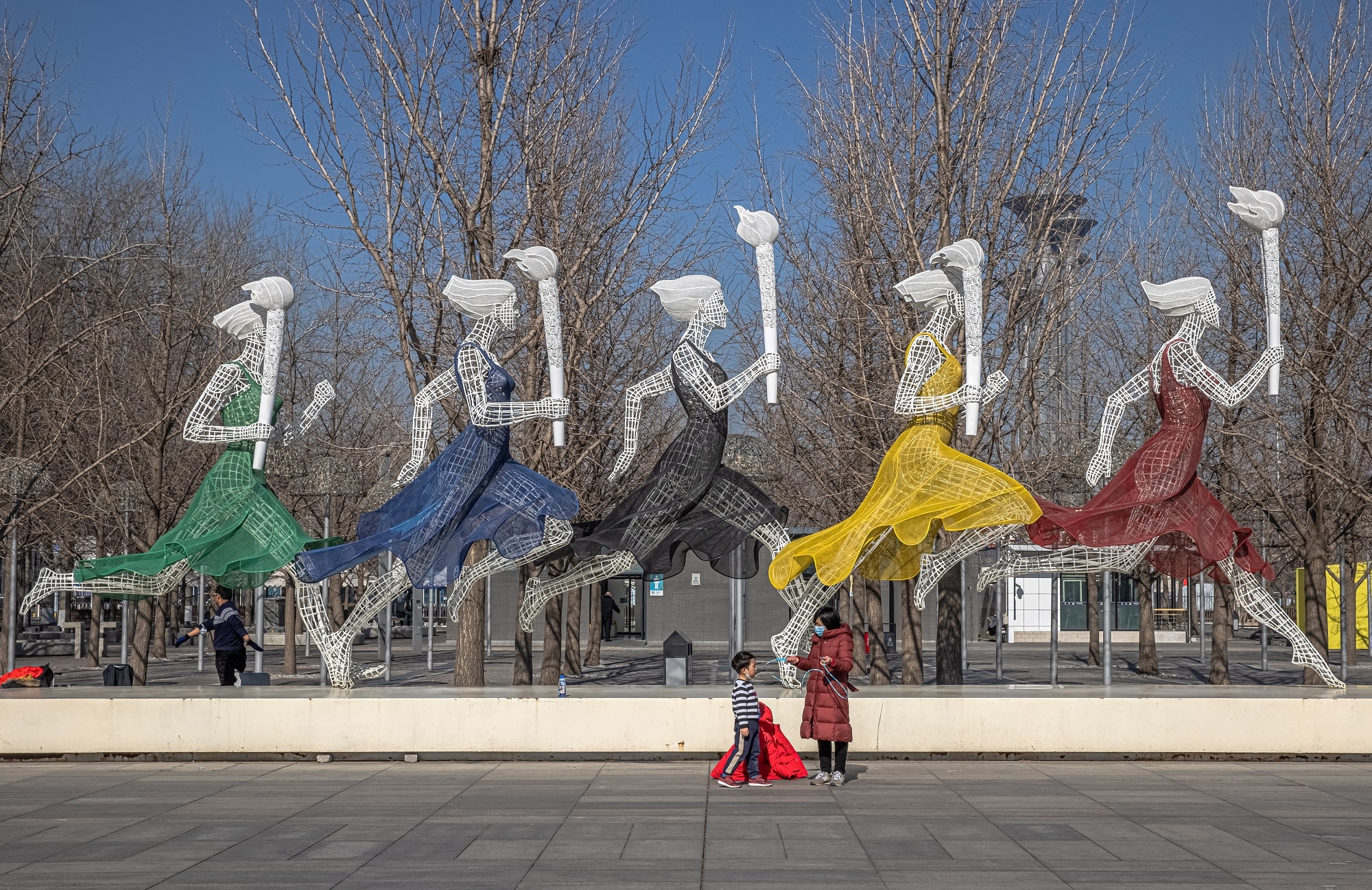 A woman with a young boy visit Beijing Olympic Park on 4 February 2021 - 365 days before the 2022 Beijing Winter Olympics. 