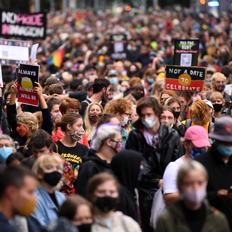 Protesters are seen during an Invasion Day rally in Melbourne. 