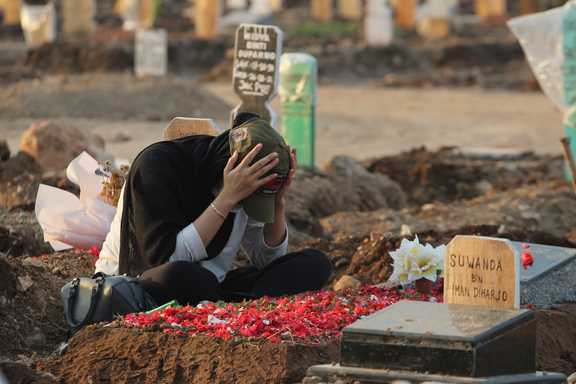 Grieving - At least 140, 000 people have died from COVID in Indonesia.