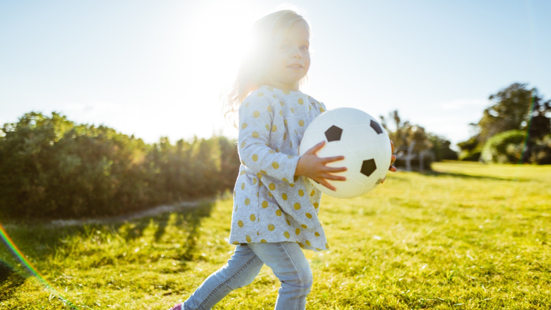 Child with a soccer ball.