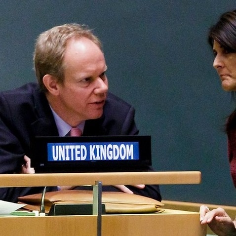 British Ambassador to the United Nations Matthew Rycroft (L) talks with US Ambassador to the United Nations Nikki Haley