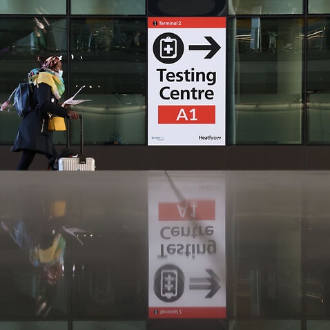 A covid testing centre sign at Heathrow Terminal 2 on November 28, 2021 in London, England, following the discovery of a new Covid-19 variant dubbed Omicron.