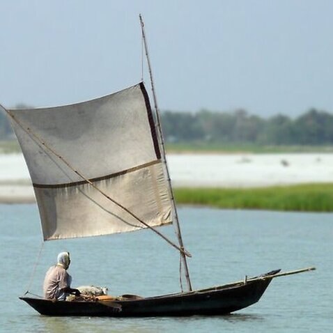 Boat sailing up the Padma River  