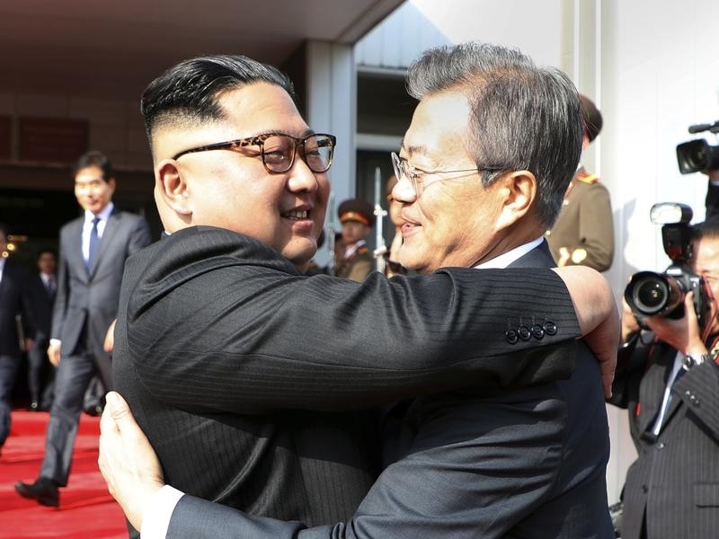 Kim Jong Un and Moon Jae-in embrace at their meeting in the DMZ