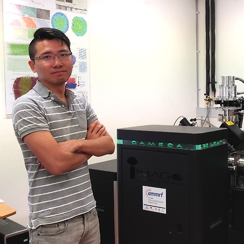 Dr Yi-Sheng Chen with the Atom Probe Tomography, key equipment that will enable his research.
