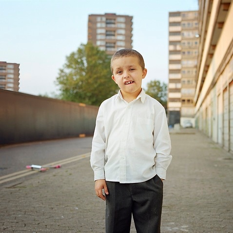 Boy on housing estate, portrait