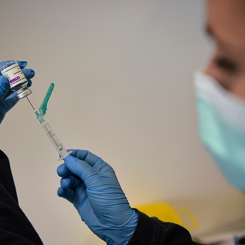 A health worker prepares a dose of the AstraZeneca vaccine in Pamplona, Spain.