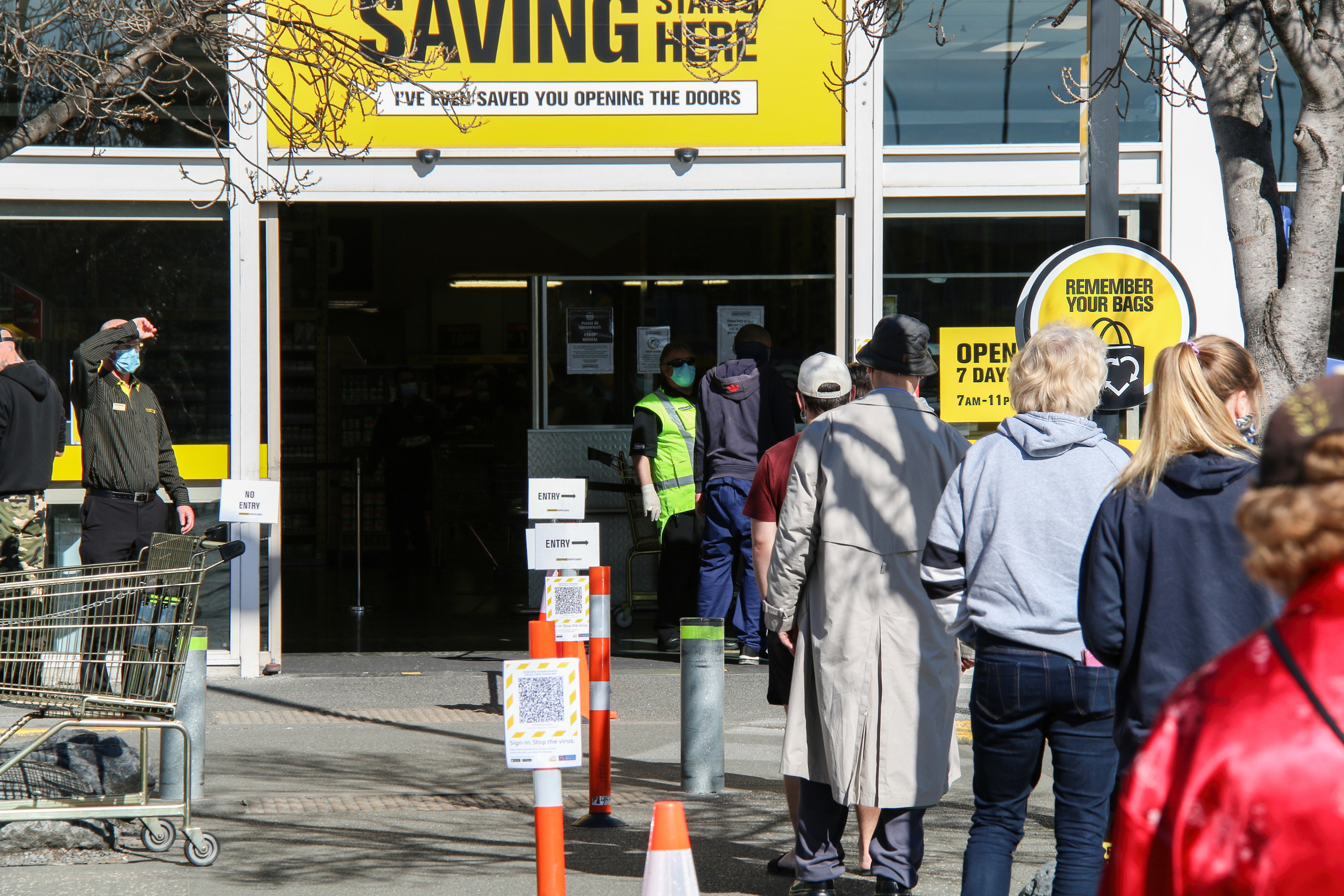 Shoppers stand in a queue at a Christchurch supermarket.