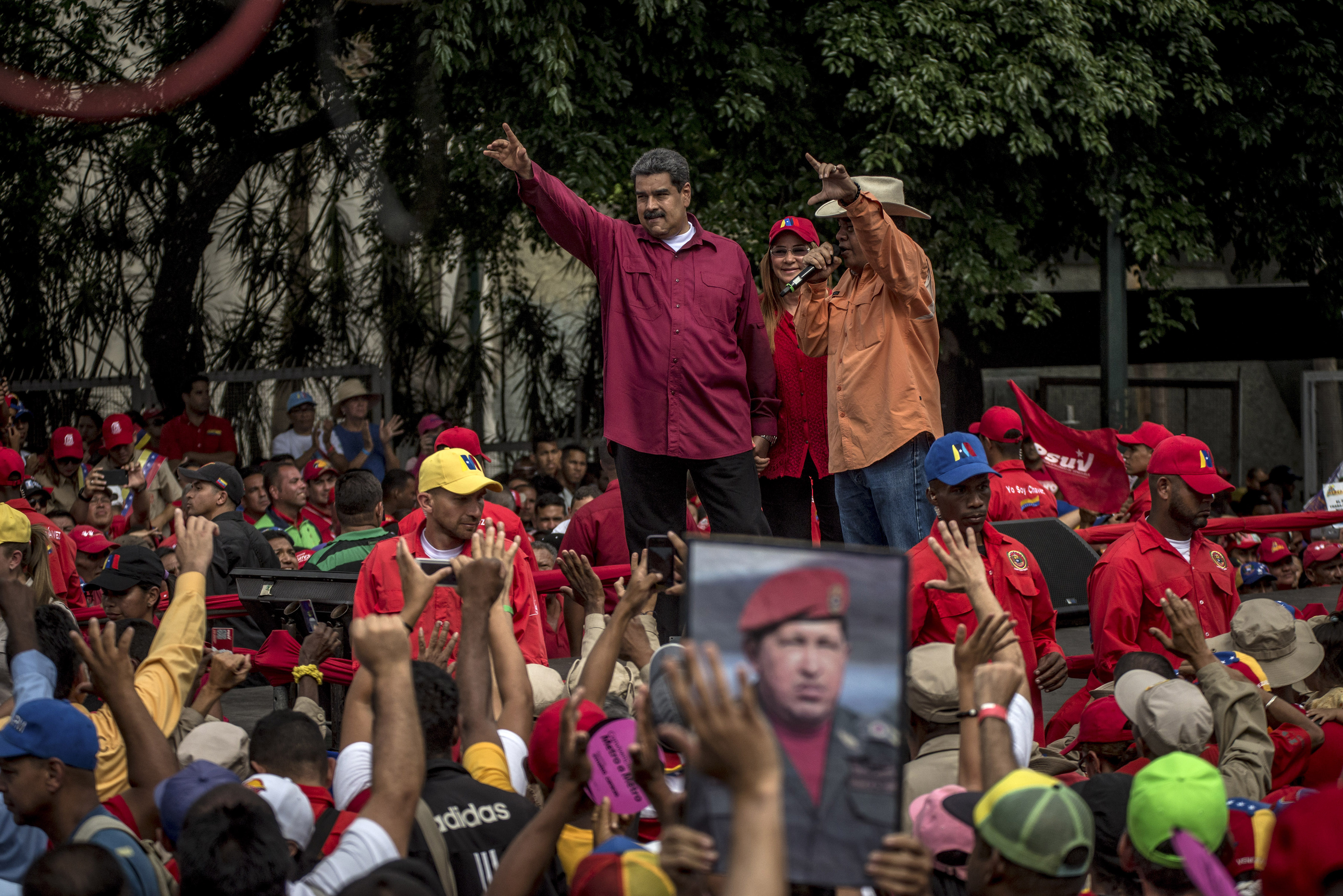 President Nicols Maduro won a snap election in 2018 despite claims of fraud from the international community. President Nicols Maduro waves to government workers at a rally in Caracas, Venezuela.