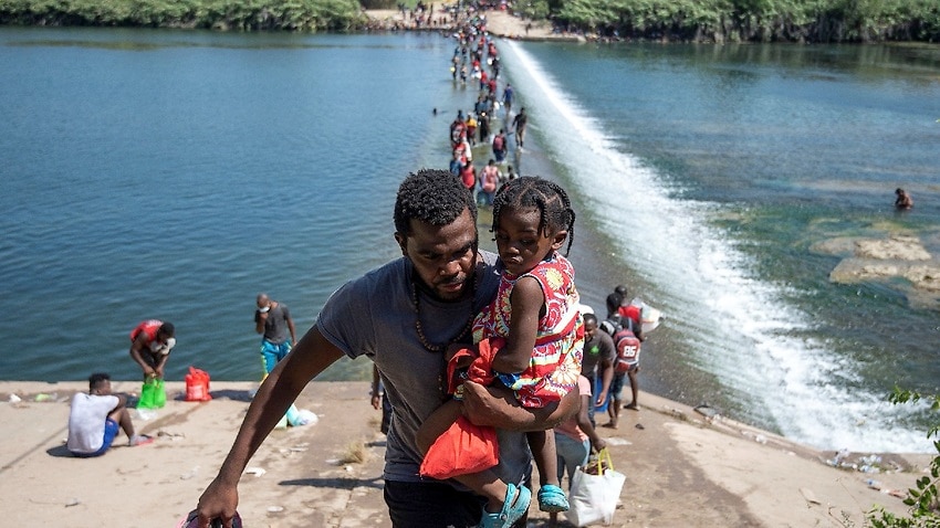 Image for read more article 'Deportation flights stepped up for migrants stranded at Texas bridge'