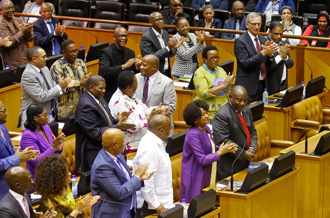 Cyril Ramaphosa, front right, is cheered by Parliament  after being elected President.