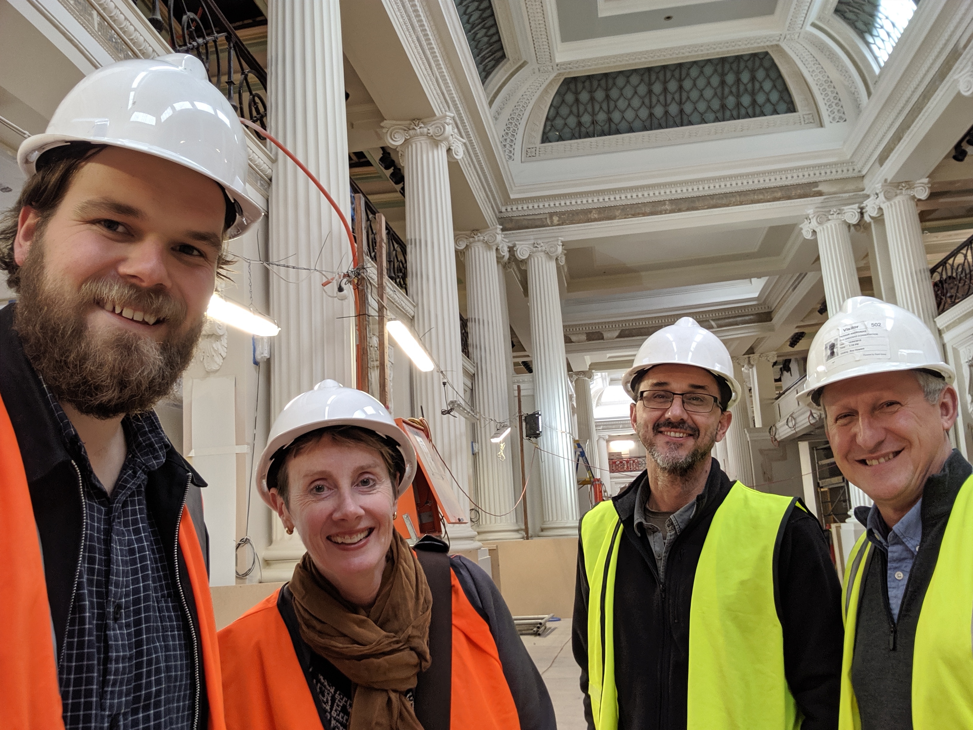 Arthur Andronas (R) with colleagues inside the State Library of Victoria during restoration works 