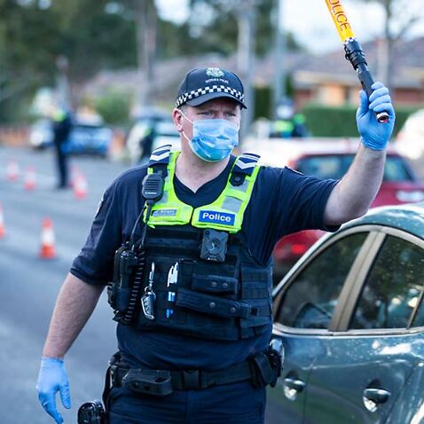 Victoria records 77 new coronavirus cases as police enforce lockdown covering 300,000 people