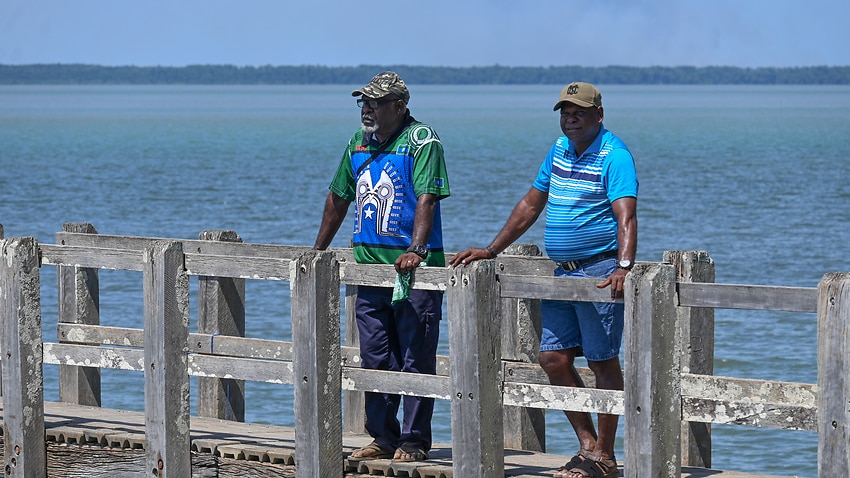Paul Kabai and Pabai Pabai on the boardwalk in Boigu.
