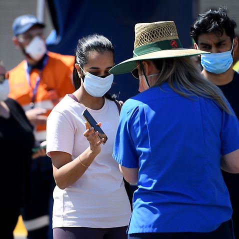 People are seen arriving at the South Western Sydney Vaccination Centre, at Macquarie Fields, Sydney, Friday, September 24, 2021. 