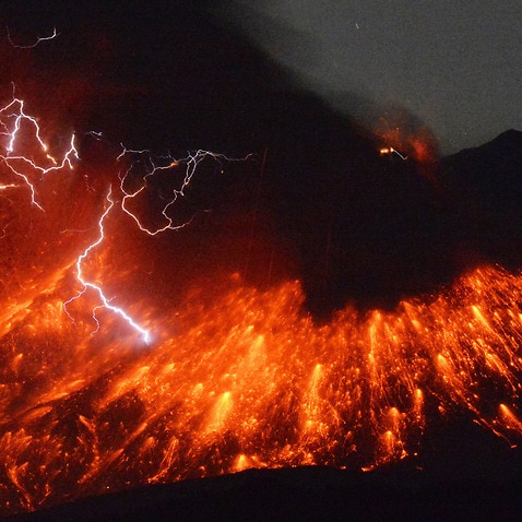Lightning flashes above flowing lava as Sakurajima, a well-known volcano, in southern Japan.