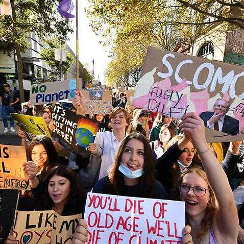 Protesters are seen during School Strike 4 Life protest, in Melbourne, Friday, May 21, 2021. Students across the country are striking in the name of climate action, calling on the federal government to stop using taxpayer money for fossil fuels. 